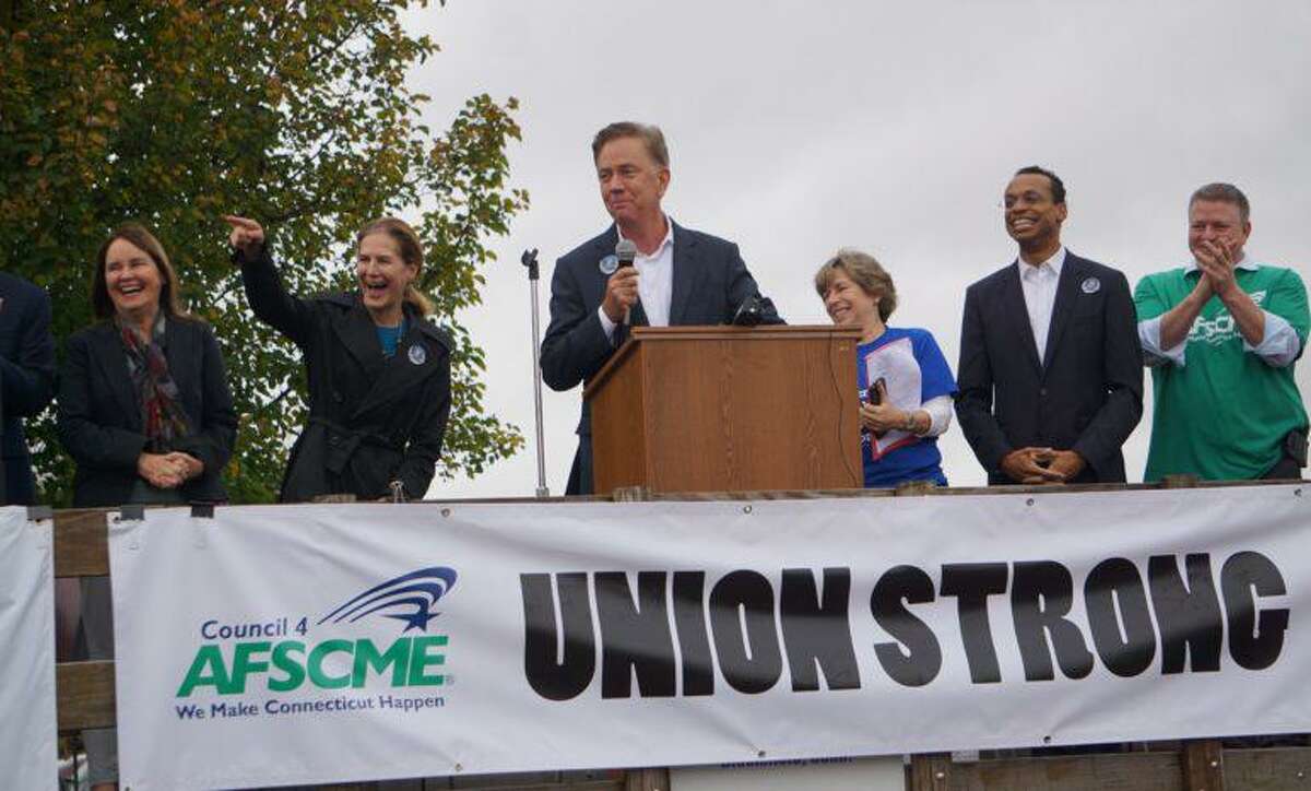 Gov. Ned Lamont, addressing a union rally as a candidate in 2018, has bumped heads with labor over telecommuting rules during the pandemic.