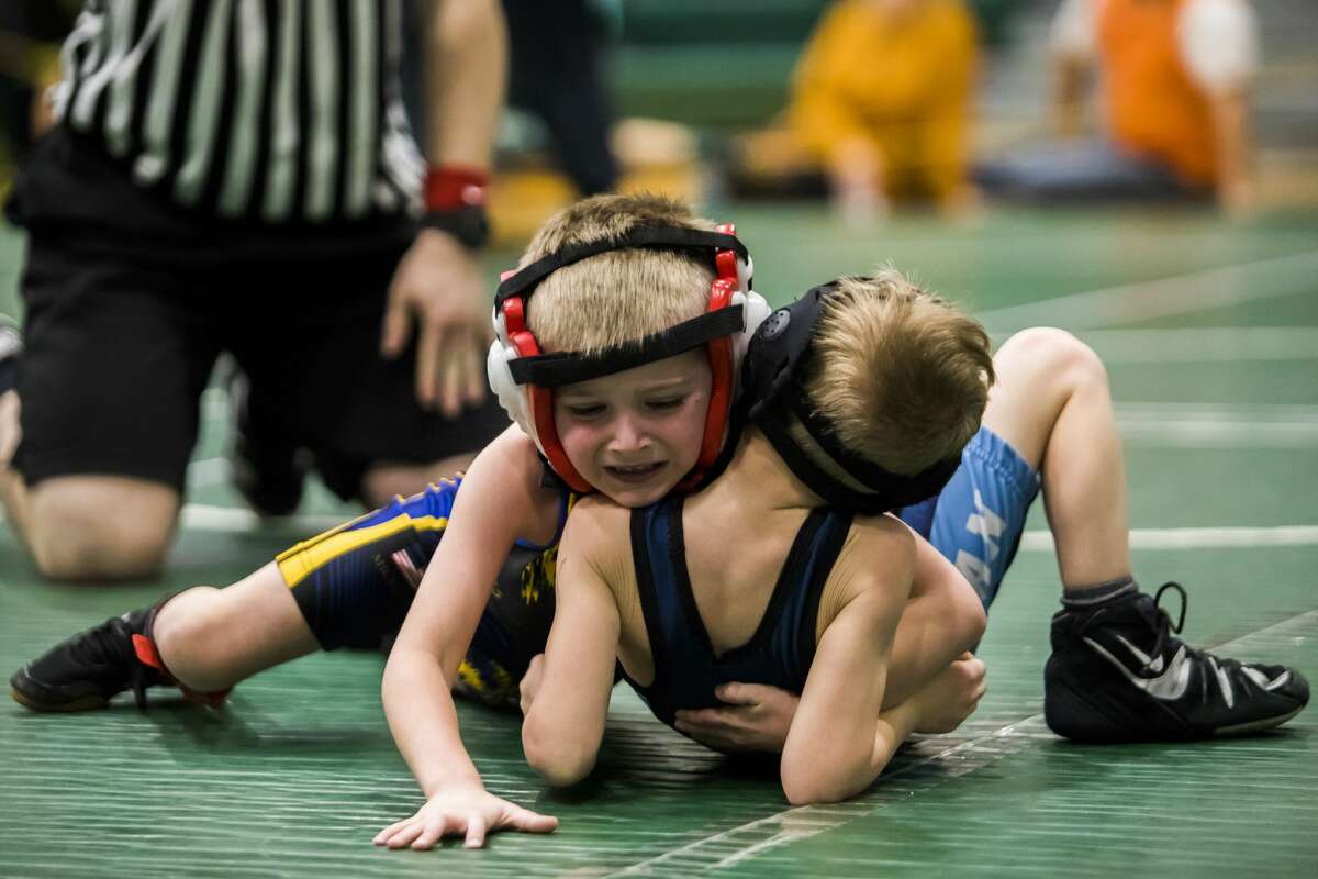 Youth wrestlers compete in the NEMWA regional tournament at Freeland High School on Feb. 16, 2019.