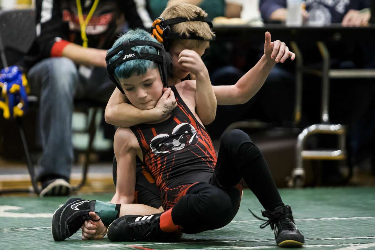 Youth wrestlers compete in the NEMWA regional tournament at Freeland High School on Feb. 16, 2019.