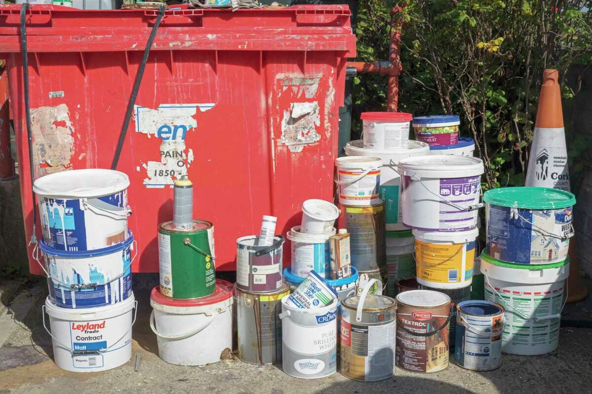 Empty paint cans sit at a collection point. The manufacture and sale of lead paint is still permitted in over 55% of countries, presenting a continuing and future source of lead exposure for children and workers worldwide. (Photo by: Ken Welsh/Education Images/Universal Images Group via Getty Images)
