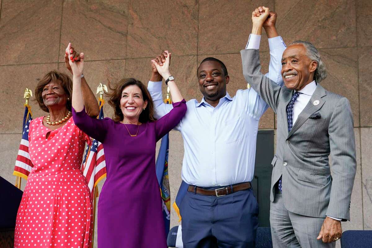Dr. Hazel N. Dukes, President of the NAACP New York State Conference, left, New York Gov. Kathy Hochul, second from left, state Sen. Brian Benjamin, and the Rev. Al Sharpton stand together during an event in the Harlem neighborhood of New York, Thursday, Aug. 26, 2021, in New York. Hochul has selected Benjamin as her choice for lieutenant governor. (AP Photo/Mary Altaffer)
