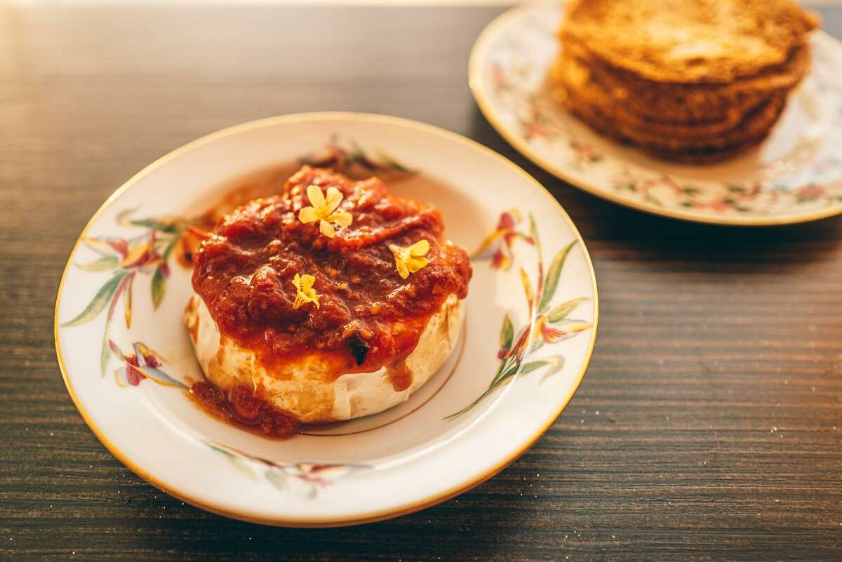 Daytrip's hot cheese featuring Langherino cheese, and a jam made with late-season early girl tomatoes and bird's eye chiles