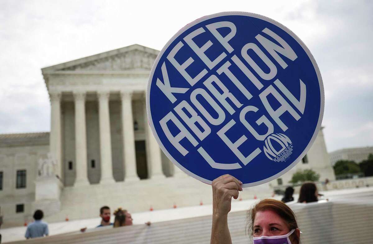 Abortion rights activists demonstrate outside the Supreme Court on Oct. 4, 2021, in Washington, D.C. (Kevin Dietsch/Getty Images/TNS)
