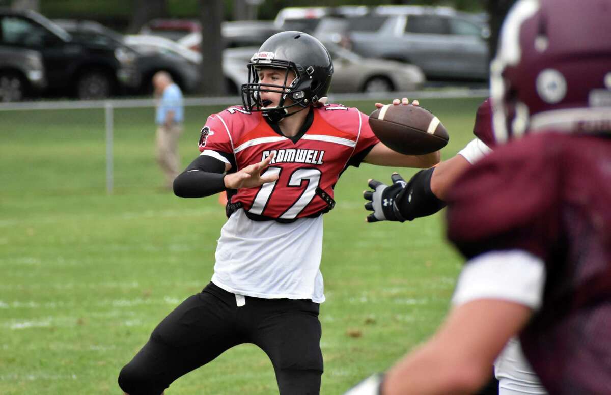 Cromwell/Portland quarterback Cole Brisson throws a pass during a quad football scrimmage at Pierson Park, Cromwell on Saturday, Aug. 28, 2021.