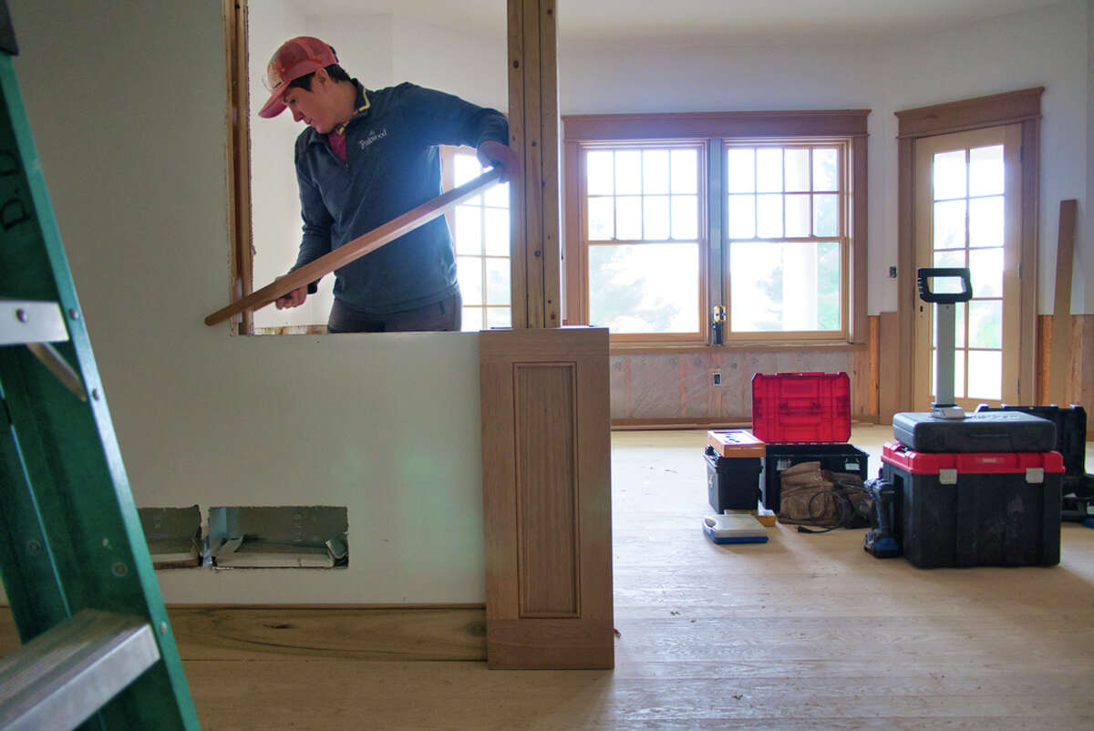 Susy Easterly, a lead carpenter at Teakwood Builders, works inside a home on Tuesday, Sept. 28, 2021, in Greenfield, N.Y.