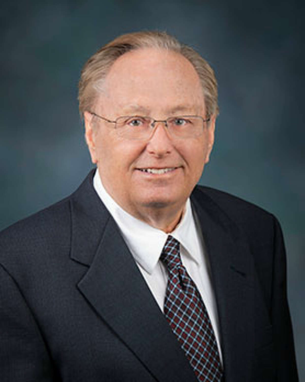 A portrait of Commissioner Doug Clark with the Michigan Independent Redistricting Commission (MICRC). As a retired operations and development manager, Commissioner Clark affiliatesas a Republican on the MICRC.During his career, Commissioner Clark worked for large, multinational companies and served inthe U.S. Army as a Captain in various armor and air cavalry units. 
