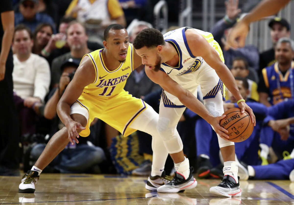 Stephen Curry of the Golden State Warriors is guarded by Avery Bradley of the Los Angeles Lakers at Chase Center on October 05, 2019.