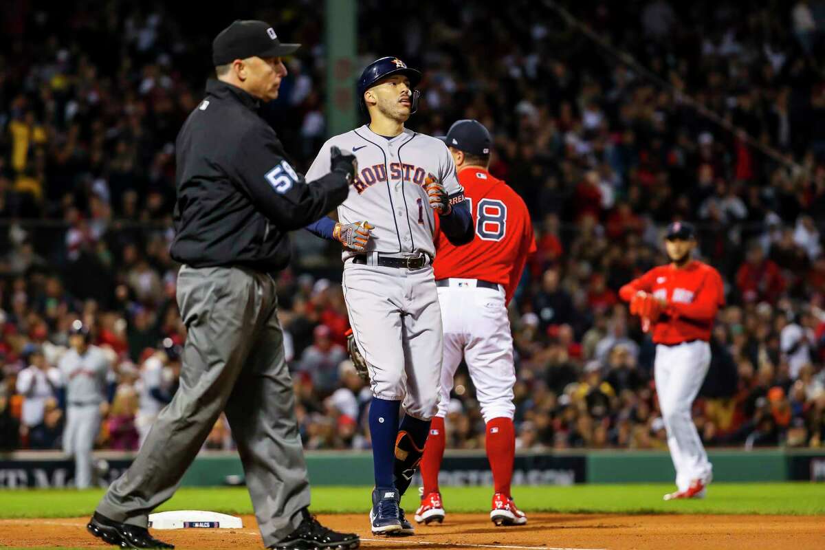Red Sox pitcher Eduardo Rodriguez points to his wrist after getting Carlos Correa to ground out to end the sixth inning in Game 3 of the American League Championship Series on Monday, Oct. 18, 2021, at Fenway Park in Boston.