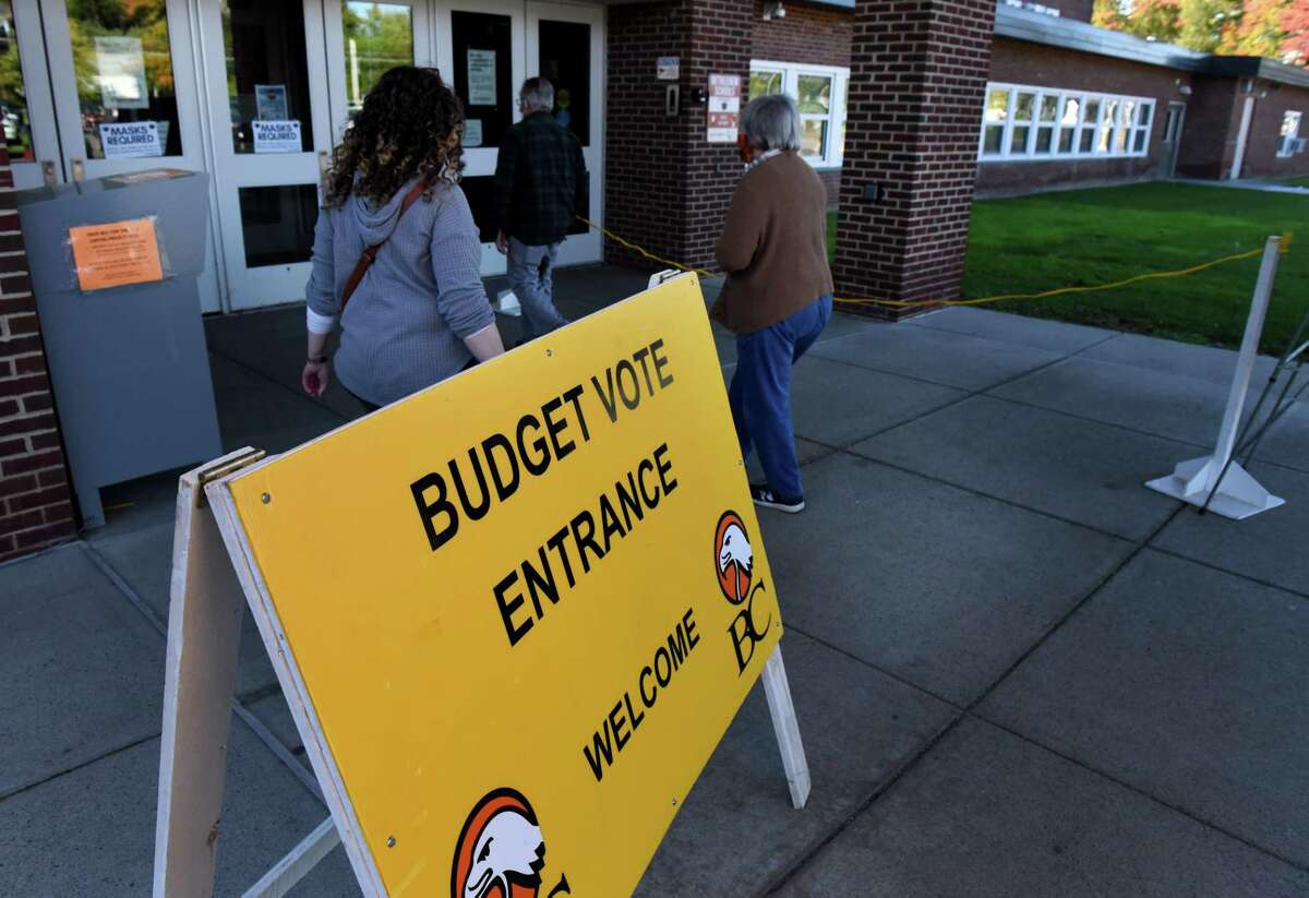 Voters head into Bethlehem High School to decide on the Bethlehem School District budget on Tuesday, Oct. 19, 2021, in Bethlehem, N.Y.