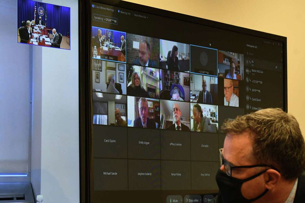 Commissioners take part in a meeting via video teleconference during a gathering of the state Joint Commission on Public Ethics on Tuesday at the JCOPE offices in Albany.