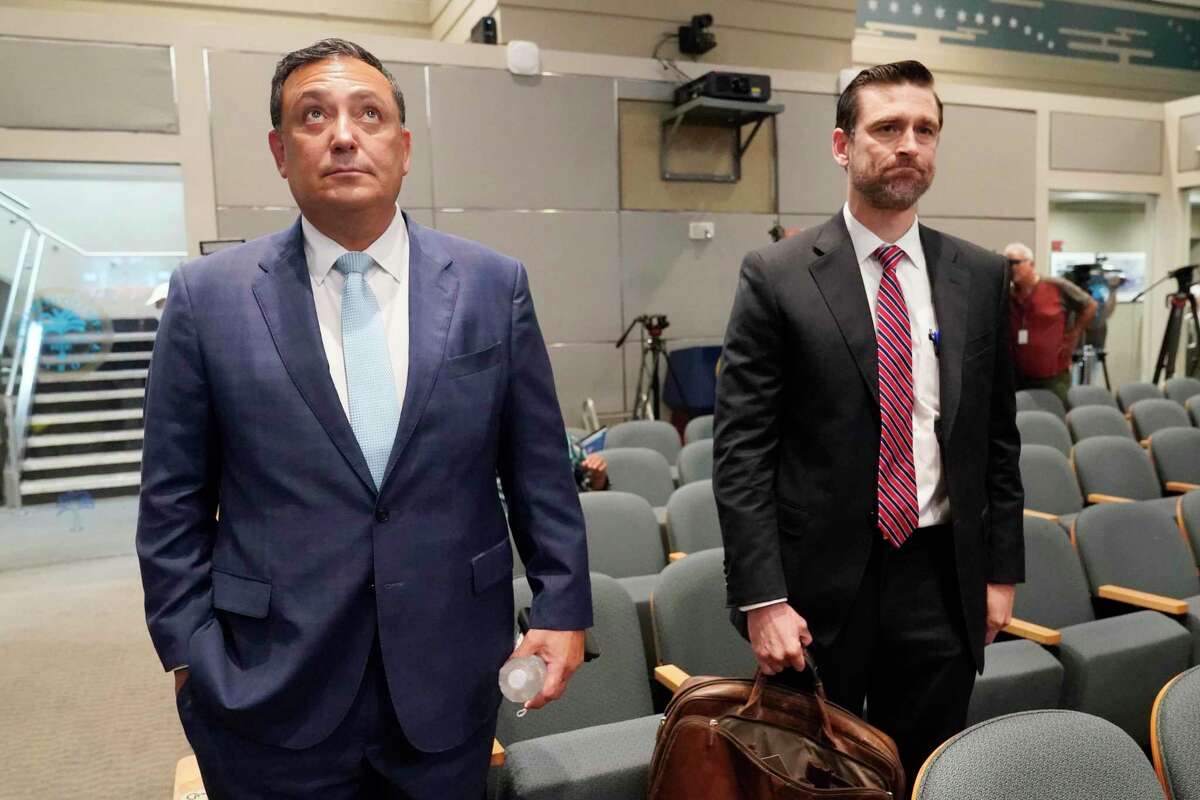 Art Acevedo and his attorney, John R. Byrne, arrive at Miami City Hall for a hearing to determine whether he would remain Miami police chief, Thursday, Oct. 14, 2021. City commissioners later voted to fire Acevedo. Acevedo had served as Houston police chief for four and a half years before accepting the Miami post in April.