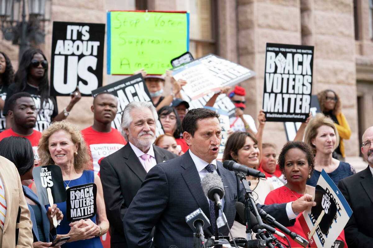 A coalition of voting rights groups including Black Voters Matter and the Texas Right to Vote Coalition rally at the Capitol to decry voter supression bills being advocated by Gov. Greg Abbott. At the mic is State Rep. Trey Martinez-Fischer, D-San Antonio.