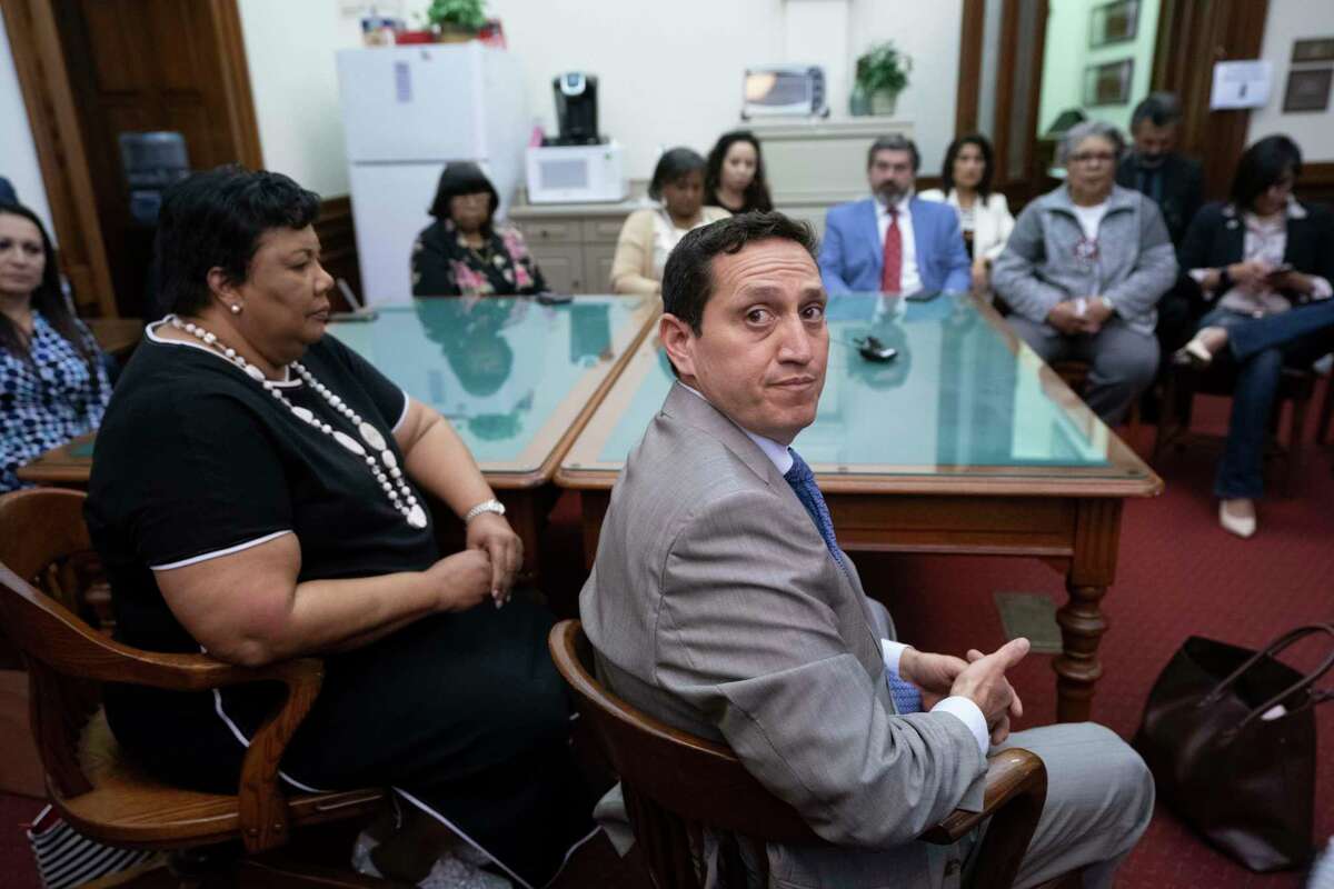 State Rep. Trey Martinez-Fischer, D-San Antonio, talks with the press after a Black and Brown Democratic meeting in the aftermath of a quorum-busting walkout that killed SB 7 on Sunday. At right is Rep. Yvonne Davis, D-Dallas