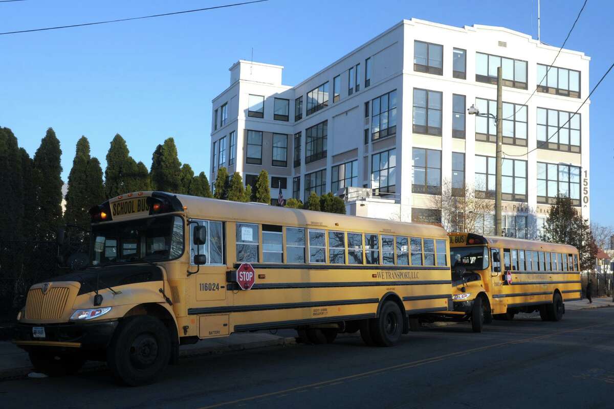 School buses line up along Mountain Grove Street at the end of the school day at Park City Prep Charter School in 2019.