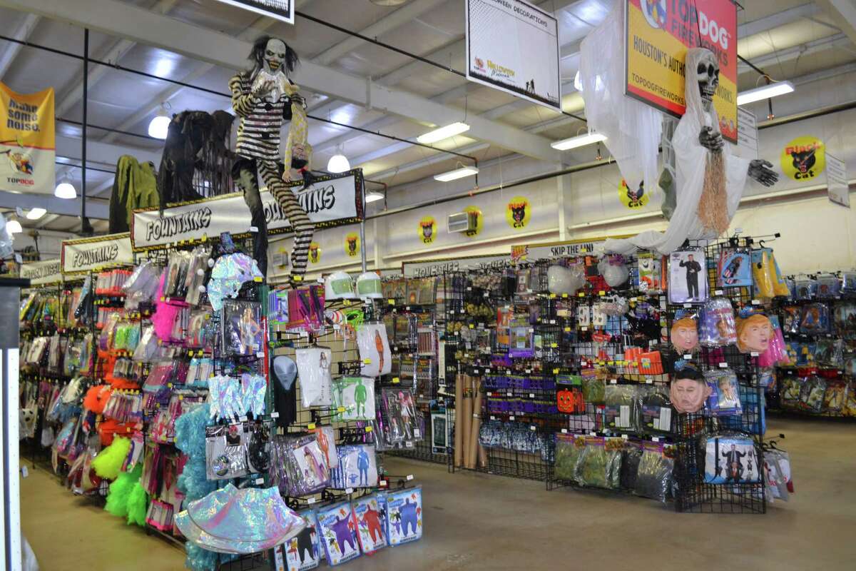 Customers shop for Halloween costumes at a TopDog store. TopDog has four stores around the Houston area, including in Tomball, Cypress and Spring.