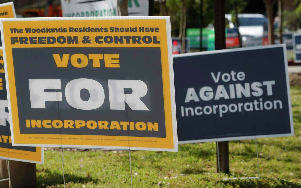 Signs for and against inforporation of The Woodlands are seen on the second day of early voting at the South Montgomery County Community Center, Tuesday, Oct. 19, 2021, in The Woodlands.