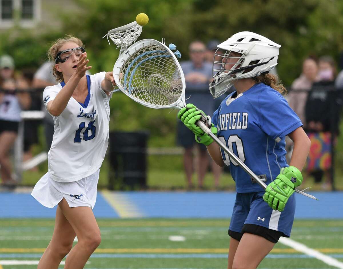 Ludlowe goalie Kennedy Carr (00) picks the ball out of the air in front of Darien’s Ceci Stein (16) during the CIAC Class L girls lacrosse final at Bunnell in Stratford on June 12. Stein and Carr were part of the U-18 team that swept through the Fall Classic for Team USA in Maryland this past weekend.