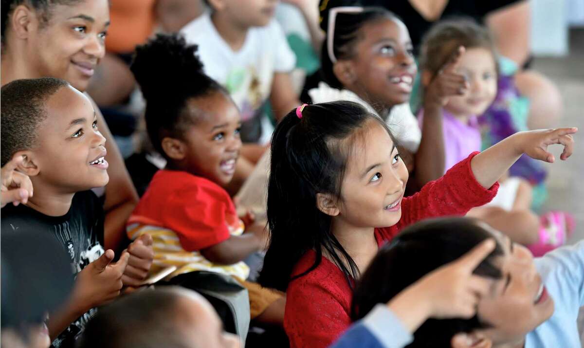 Children enjoy watching the performance of Tony the Magic Man as he plays his tricks to an audience at the New Haven Health Department's 19th Annual Lead Education Picnic on June 9, 2019 in New Haven, Conn. The interactive event educates local families about childhood lead poisoning prevention through discussion, educational giveaways, food and entertainment.