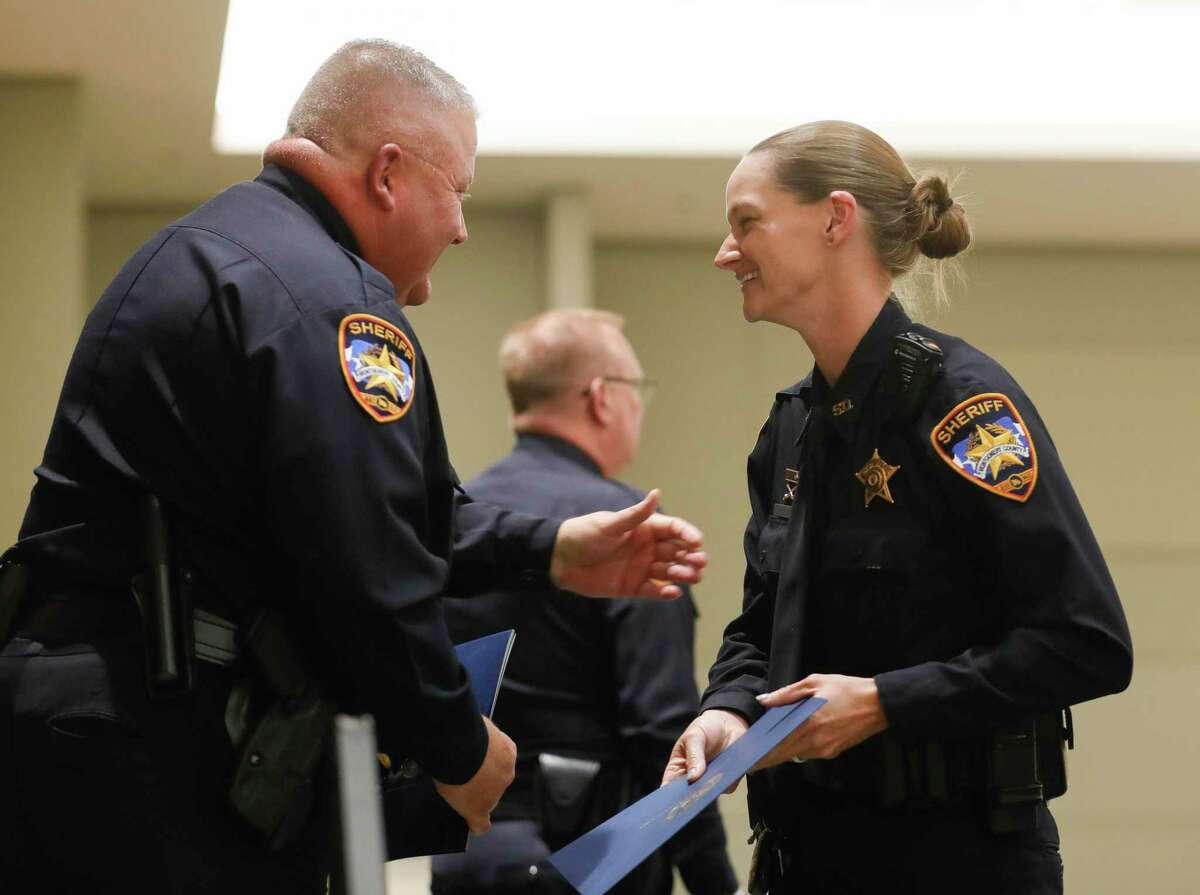Montgomery County Sheriff’s Office Specialist Amy Blackwelder laughs during the department’s annual promotions and awards ceremony.
