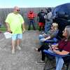 Locked out USW workers who voted in the morning shift wait outside the IBEW union hall in Beaumont to await the results on the proposal set forth by ExxonMobil. Photo made Tuesday, October 19, 2021 Kim Brent/The Enterprise