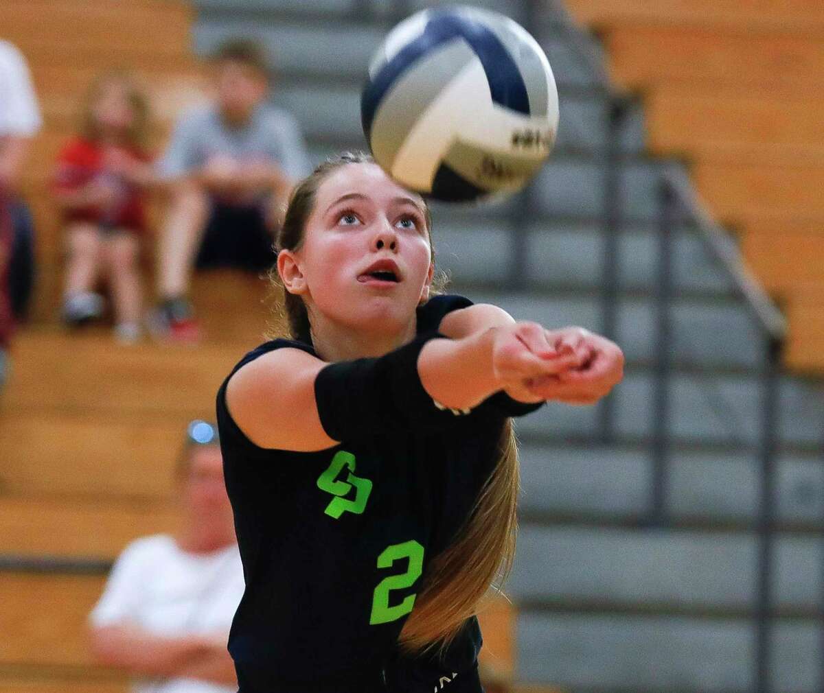 College Park’s Morgan Madison (2) returns a hit during the first set of a high school volleyball match at The Woodlands High School, Tuesday, Oct. 5, 2021, in The Woodlands.
