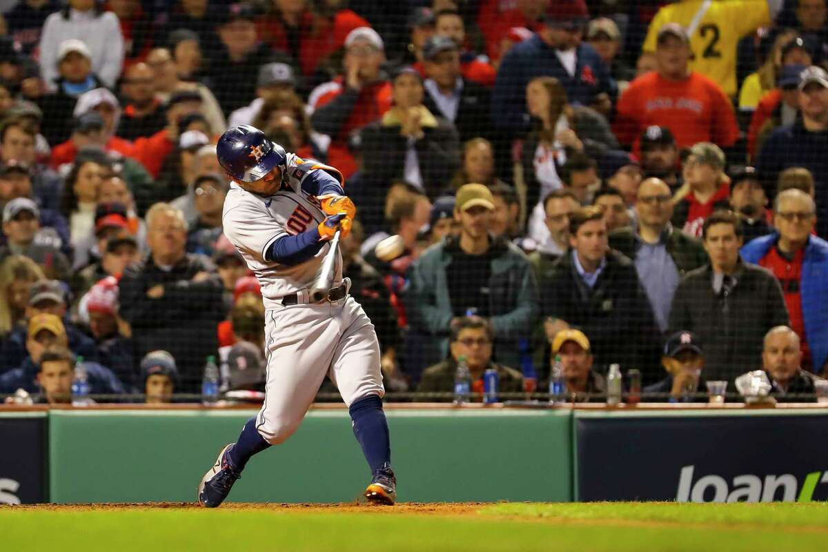 Jose Altuve connects for the tying homer on the first pitch of the eighth inning of Game 4 of the ALCS against the Red Sox on Tuesday at Fenway Park in Boston.