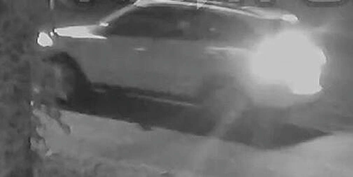 A surveillance camera captured this image of a white sport utility vehicle leaving the 600 block of South Prairie Street at the time gunfire erupted Monday night. Police believe the driver of the vehicle, which turned west onto West Chamber Street, could have information to assist in the case.