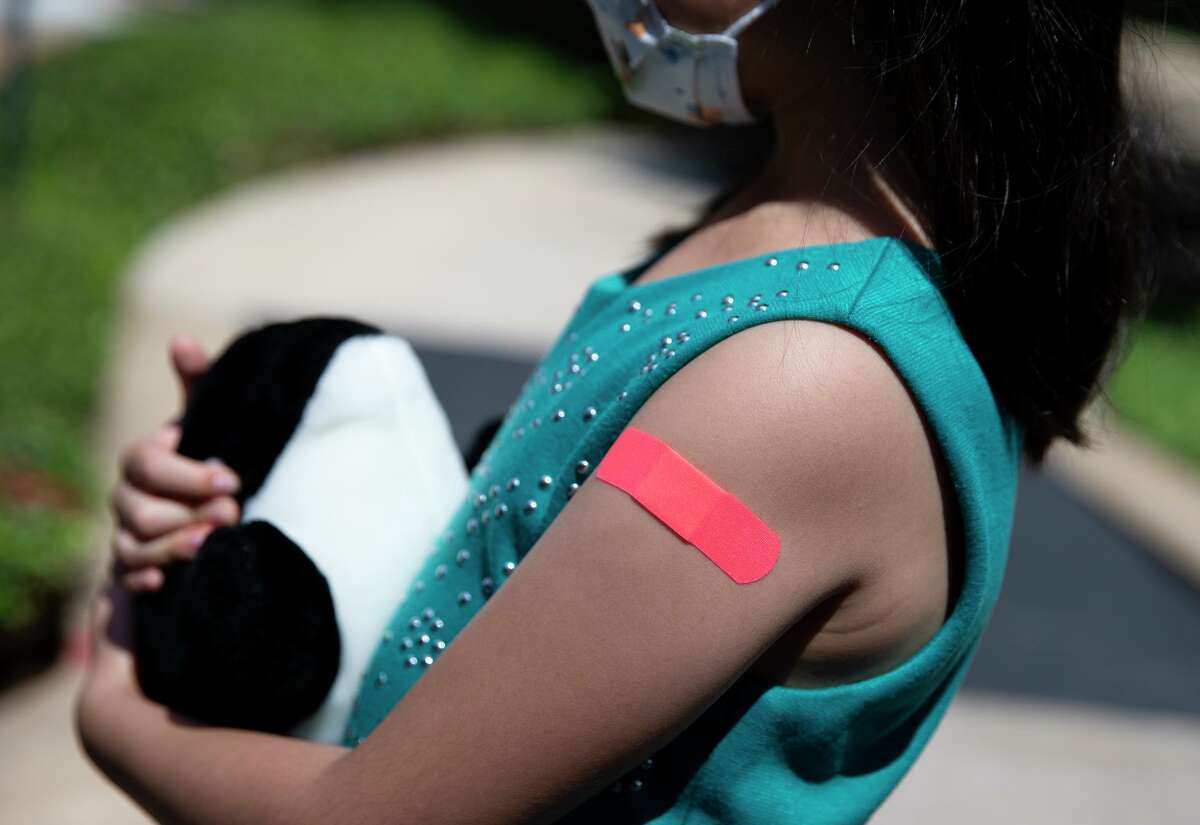 This seven-year-old girl received her second dose of Pfizer’s COVID-19 vaccine in September at Texas Children's Hospital in Houston as part of a trial. Children in her age group are expected to be broadly eligible for the Pfizer vaccine in November, after regulatory authorization.