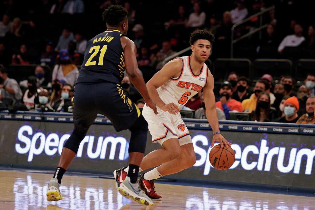 New York Knicks guard Quentin Grimes (6) looks around Indiana Pacers guard Kelan Martin (21) during the second half of a preseason NBA basketball game Tuesday, Oct. 5, 2021, in New York. The Knicks won 125-104. (AP Photo/Adam Hunger)