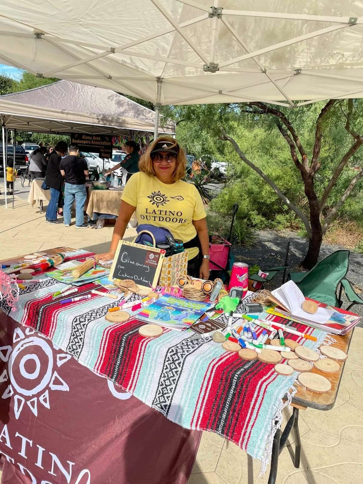 Latino Outdoors set up a booth at the Monarch and Pollinator Festival spread throughout Confluence Park.