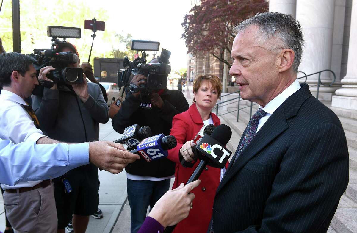 Attorney John Gulash, right, speaks with the press outside of federal courthouse in New Haven following the arrest of his client, state Rep. Michael DiMassa, on one count of wire fraud on Oct. 20, 2021.