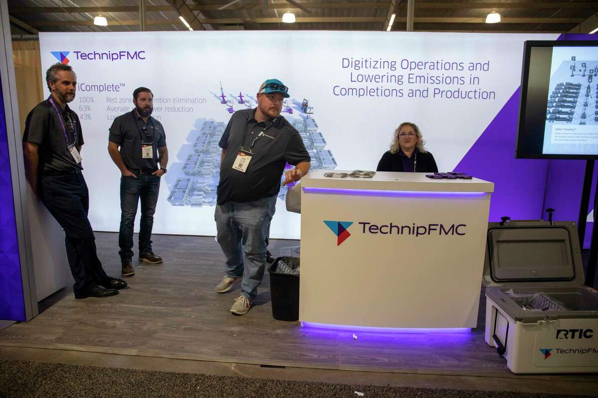 Technip employees wait for attendees to talk to Permian Basin International Oil Show on Wednesday, Oct. 20, 2021 at Ector County Coliseum. The company is seeing demand for more stages in the completion process, quicker moves from well to well and efforts to address emissions from production facilities.