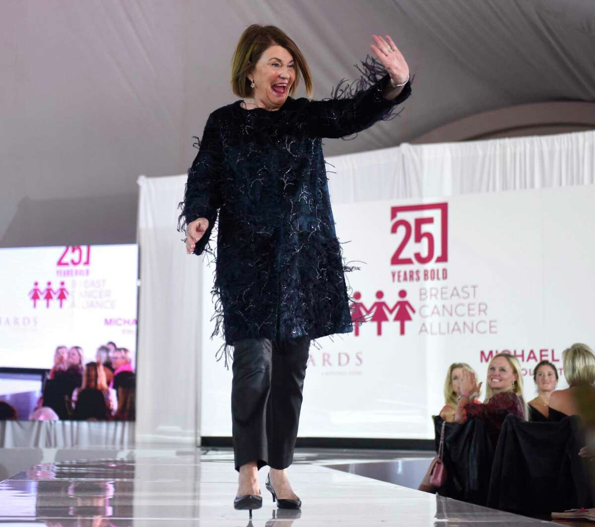 Breast cancer survivor Barbara Ripp, of Greenwich, walks the runway at the Breast Cancer Alliance 25th Anniversary Luncheon & Fashion Show at the Westchester Country Club in Rye, N.Y. Wednesday, Oct. 20, 2021. The breast cancer fundraising event featured a fashion show presented by Richards with looks from Michael Kors 40th anniversary collection, as well as a fashion show from breast cancer survivors.