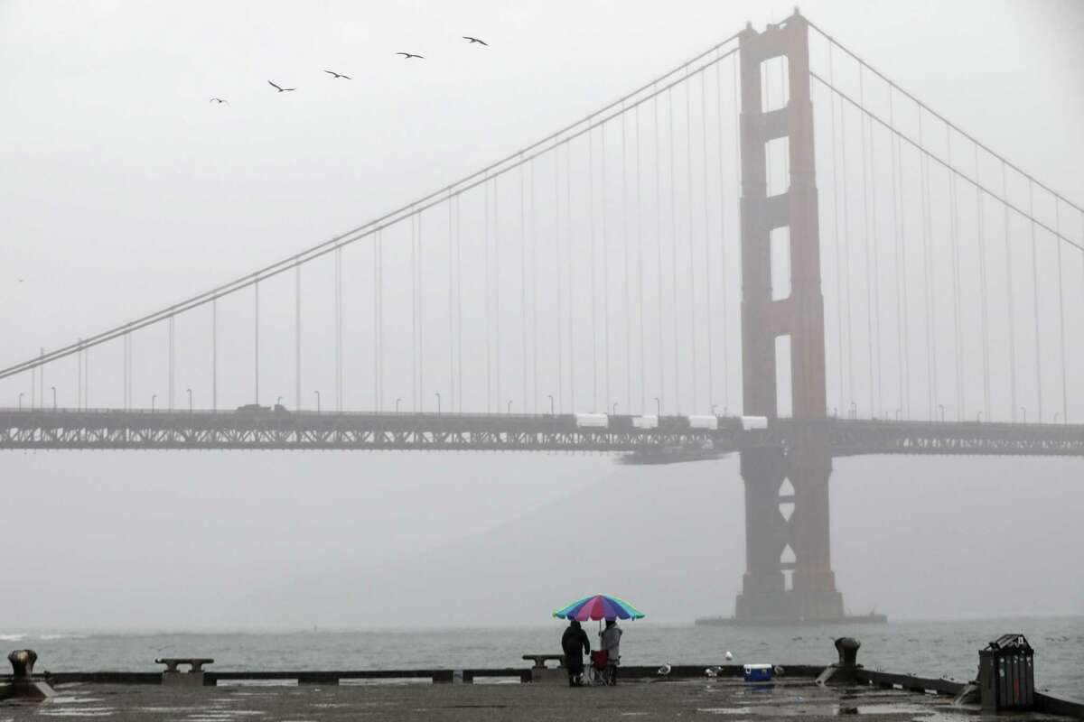 A misty view of the Golden Gate Bridge can be seen from Torpedo Wharf at Fort Point in San Francisco, Calif. on Wednesday, Oct. 20, 2021. Back-to-back rain storms are expected to drench the Bay Area this week.