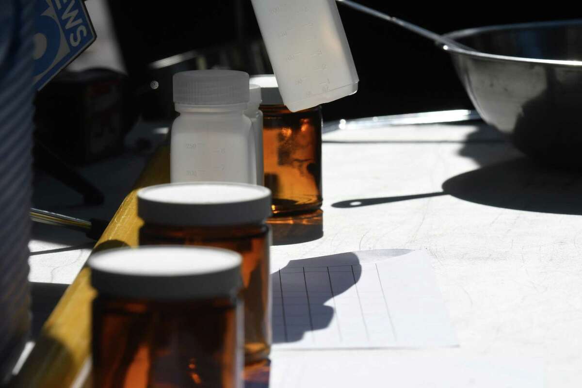 Containers used to collect soil and water samples to detect for PFAS from the Norlite aggregate plant are displayed during a New York State Department of Conservation press conference on Thursday, Oct. 1, 2020, in Cohoes, N.Y.