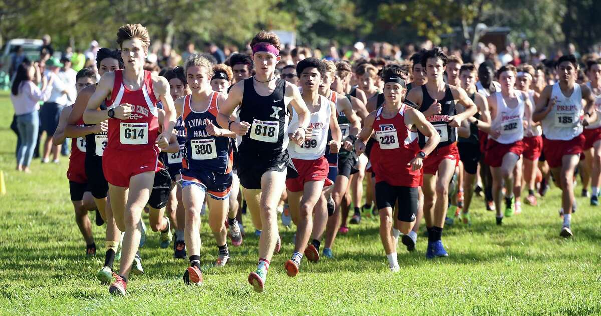 Xavier’s Eamon Burke (618) jumps to the front of the pack at the start of the SCC Cross Country Championship at East Shore Park in New Haven on Wednesday.