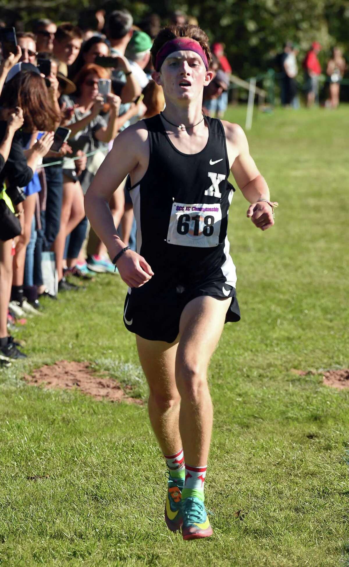 Xavier’s Eamon Burke finishes first in the SCC Cross Country Championship at East Shore Park in New Haven on Wednesday.