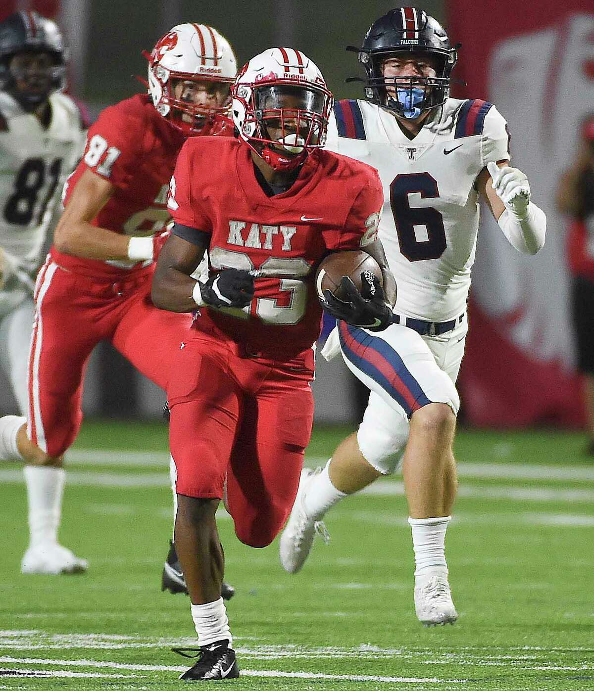Katy running back Seth Davis, left, runs for a touchdown during the second half of a high school football game against Tompkins, Friday, Oct. 1, 2021, in Katy.