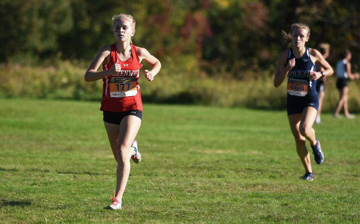 Greenwich's Esme Daplyn (177) heads into the home stretch with Wilton's Emily Mrakovic (464) in pursuit during the FCIAC girls cross country championship in New Canaan's Waveny Park on Wednesday, Oct, 20, 2021.