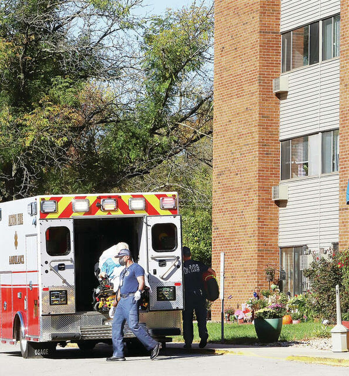 Alton Fire Department paramedics load a fourth-floor resident of Skyline Towers senior apartments into an ambulance Monday after she suffered a medical problem. Firefighters brought her downstairs on the smaller of two elevators located in the building. Over the weekend, both elevators were out, essentially trapping the elderly residents who could not use the stairs. The situation creates problems for firefighters, who without the elevators, would have to carry sick residents down the stairs of the five-story building. Residents reported that shortly after this rescue call, the second elevator broke again, leaving them stranded.