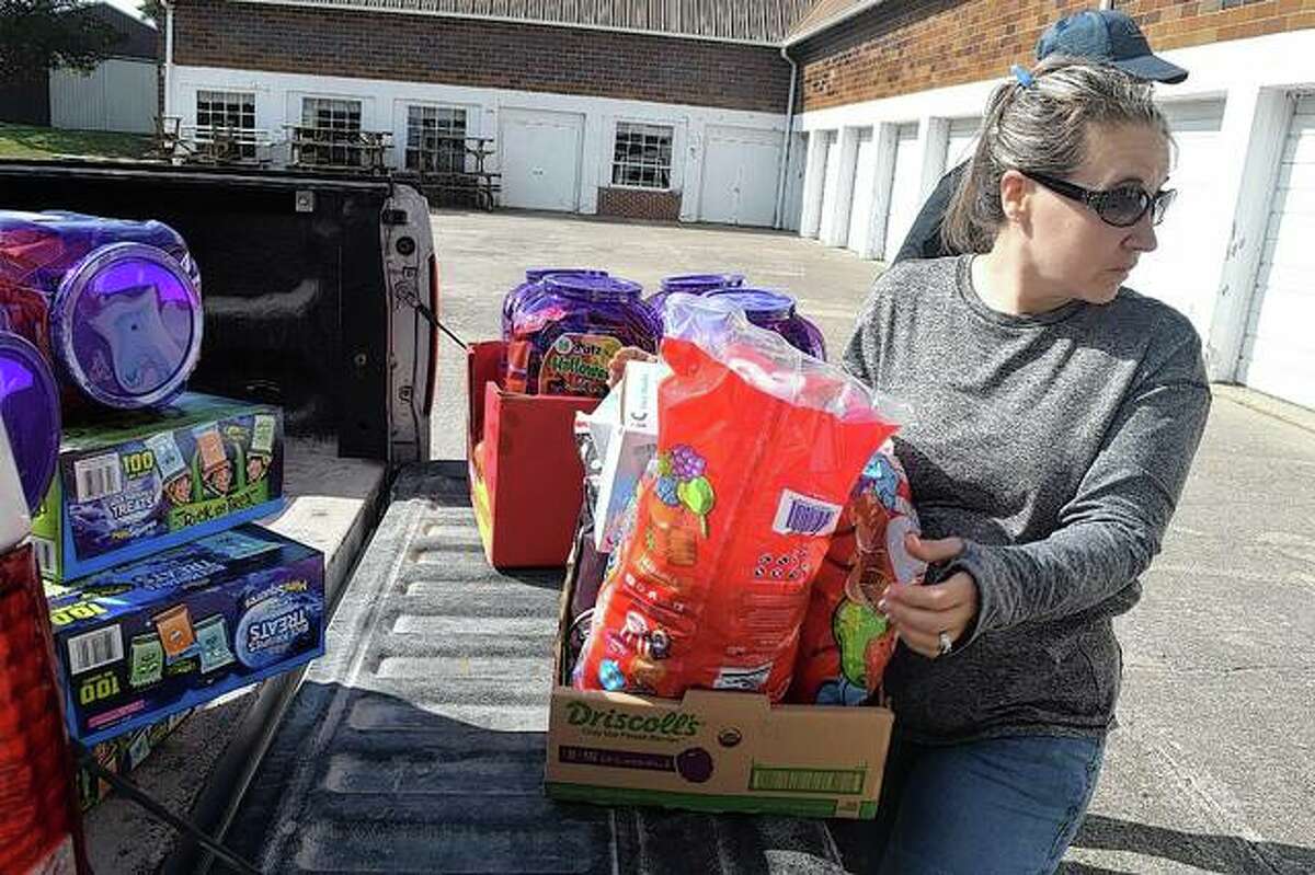 Tia Kephart of WJIL-WJVO unloads candy Wednesday at Prairie Land Heritage Museum in preparation for Safe Halloween, which will be from 4 to 6 p.m. today on the museum grounds.