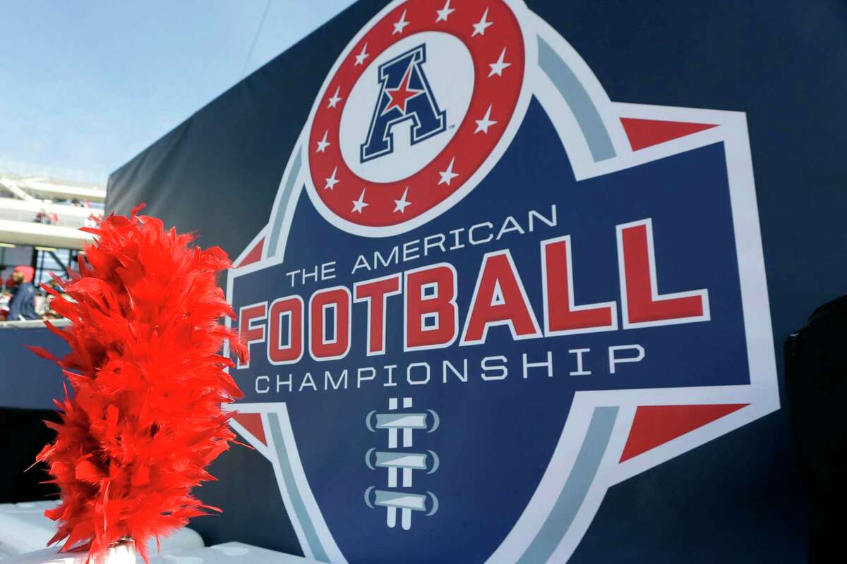 FILE - In this Dec. 5, 2015, file photo, the American Athletic Conference logo is displayed before during the championship NCAA college football game between Houston and Temple in Houston. Six schools from Conference USA — UAB, UTSA, Rice, North Texas, Charlotte and Florida Atlantic — have applied for membership with the AAC and are expected to be accepted by the end of the week, according to two people with knowledge of the process who spoke with The Associated Press, Wednesday, Oct. 20, 2021. (AP Photo/David J. Phillip, File)