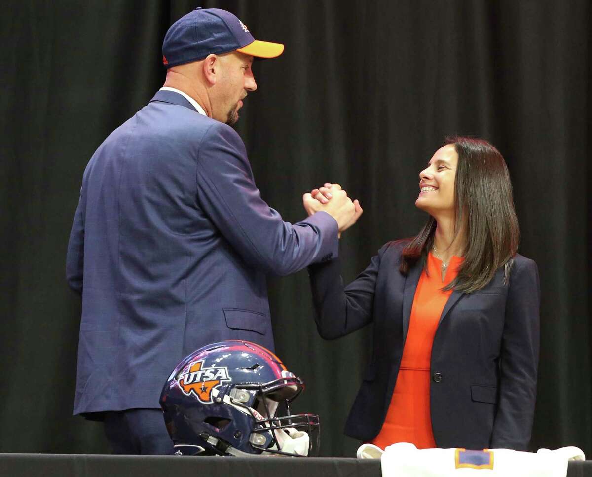 New UTSA head football coach, Jeff Traylor (left), shakes hands with UTSA Vice President for Intercollegiate Athletics Lisa Campos after a public announcement of Traylor's hiring at the Alamodome on Tuesday, Dec. 10, 2019. With introductions by UTSA President Dr. Taylor Eighmy and UTSA Vice President for Intercollegiate Athletics Lisa Campos, Traylor spoke with fervor about the path that led him to UTSA. With past and present players in the audience, Traylor also touched on his coaching philosophy and the steps he will take to help the Roadrunners succeed under his helm. Traylor is the third coach in the school's eighth year in collegiate football.