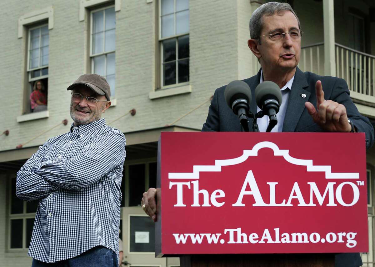 Former Texas Land Commissioner Jerry Patterson, shown in a 2014 photo at the Alamo with Phil Collins, helped negotiate donation of the musician’s collection of artifacts to the Alamo. Patterson will serve on the 1836 Project Advisory Committee, but he doesn’t expect the group’s work to significantly impact the Alamo project, currently underway.