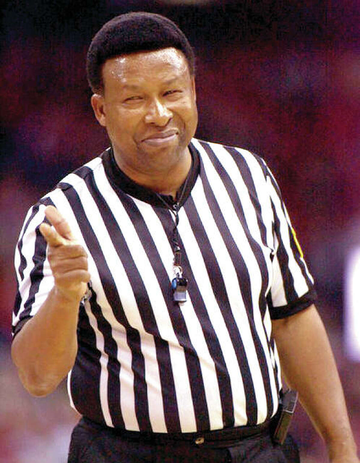 Former Edwardsville District 7 Superintendent Ed Hightower points after calling a foul during his days as one of the top NCAA basketball officials.