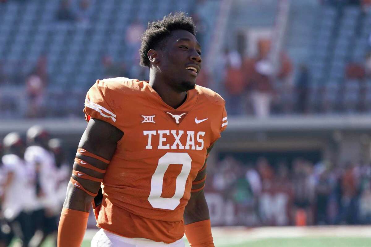 Texas linebacker DeMarvion Overshown (0) pauses after taking the field before an NCAA college football game against Oklahoma State in Austin, Texas, Saturday, Oct. 16, 2021. (AP Photo/Chuck Burton)