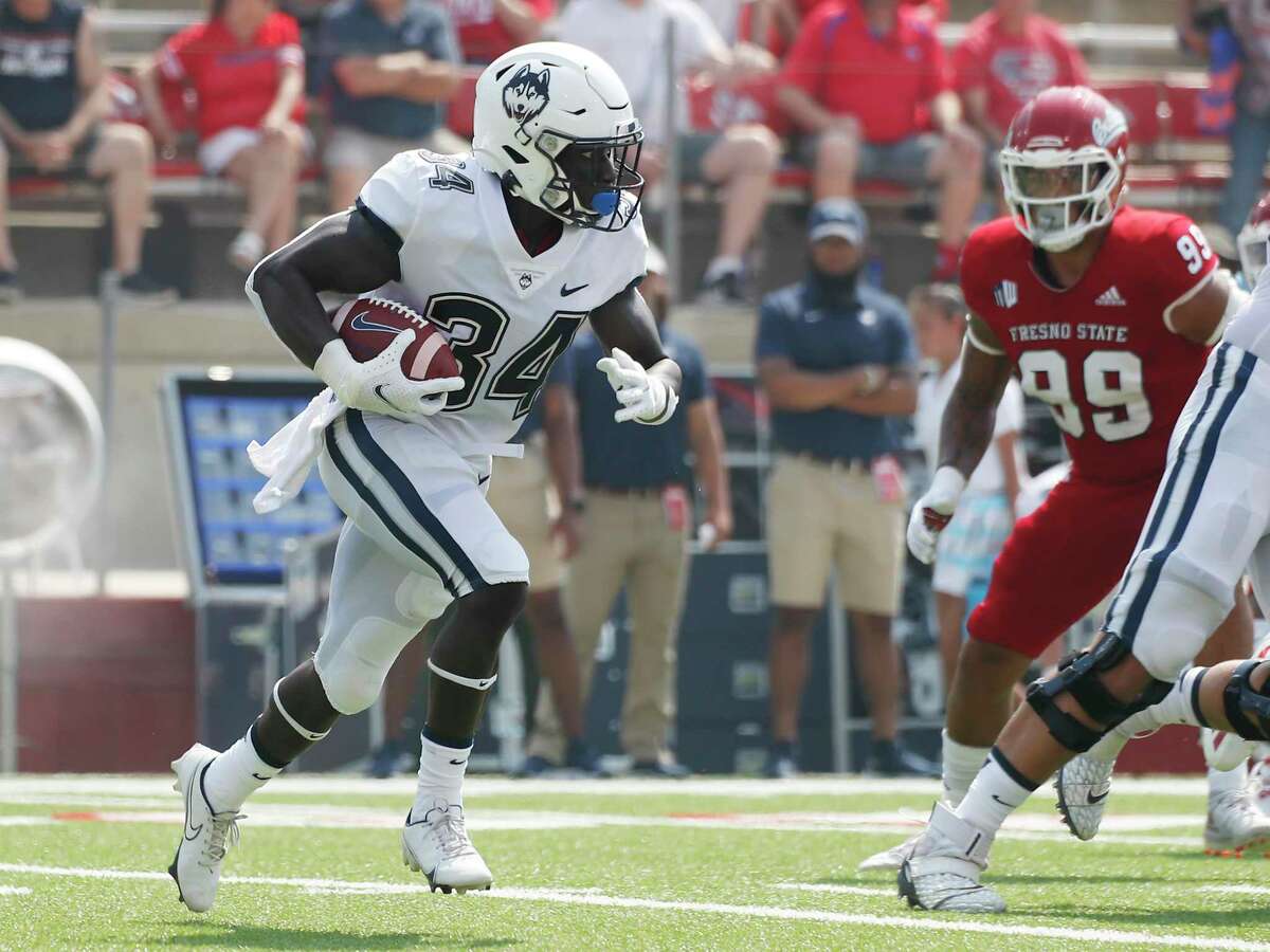 UConn running back Kevin Mensah runs against Fresno State during the first half during a game in August.