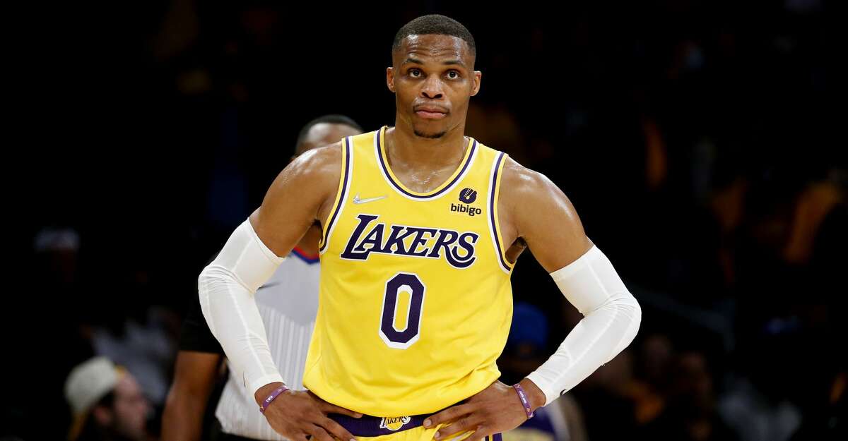 Los Angeles Lakers guard Russell Westbrook (0) looks on against the Golden State Warriors during the second half of an NBA basketball game in Los Angeles, Tuesday, Oct. 19, 2021. The Warriors won 121-114. (AP Photo/Ringo H.W. Chiu)