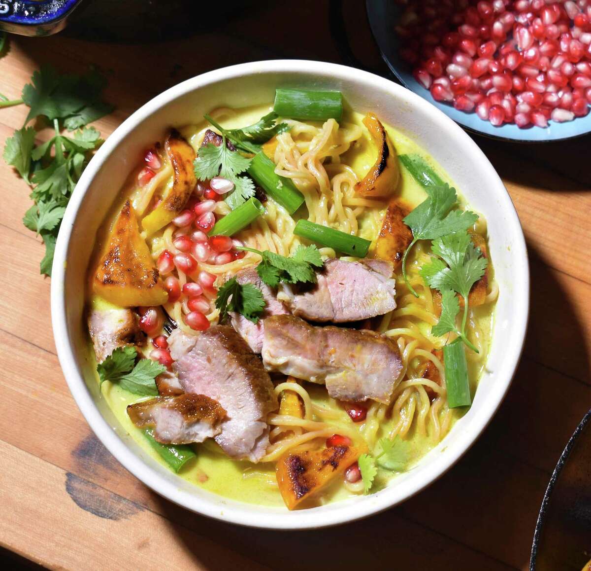 Roasted kabocha squash adds a sweet note to this ramen dish, and ginger and curry add warming notes of spiciness. Caramelized pork shoulder is the topper.