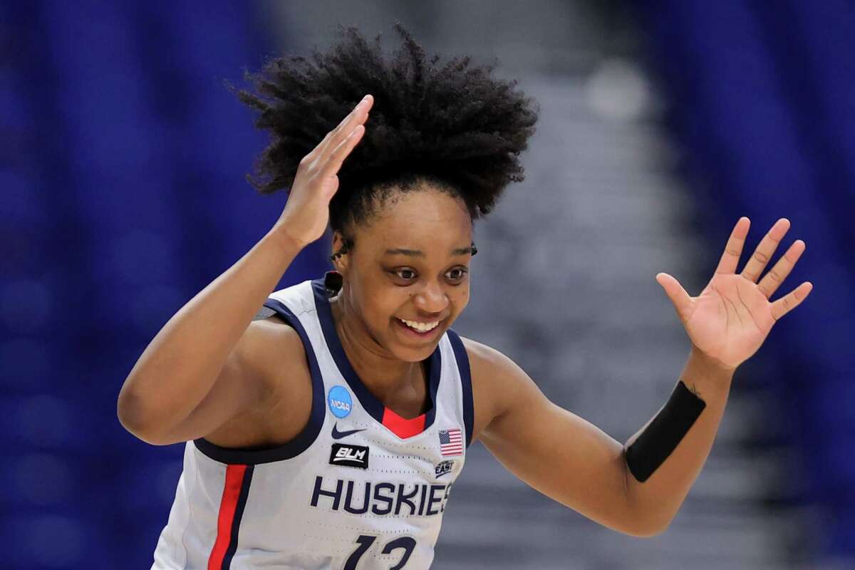 UConn’s Christyn Williams reacts after a 3-point shot against Syracuse during the second round of the NCAA Tournament on March 23.
